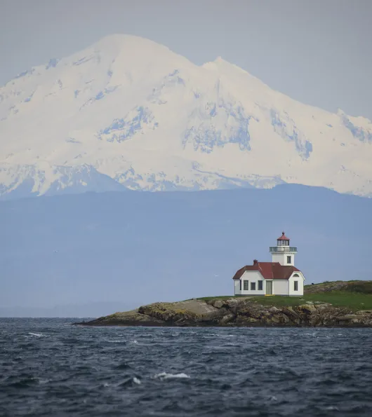 Lighthouse with mountains